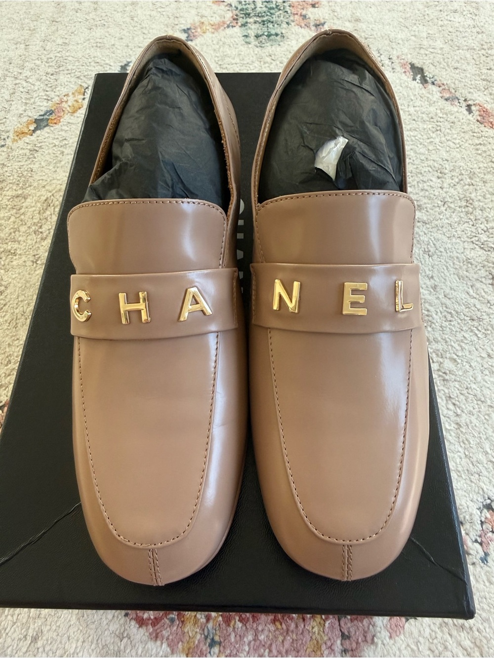 CHANEL Apricot Leather Slip-On Loafers with Gold Lettering